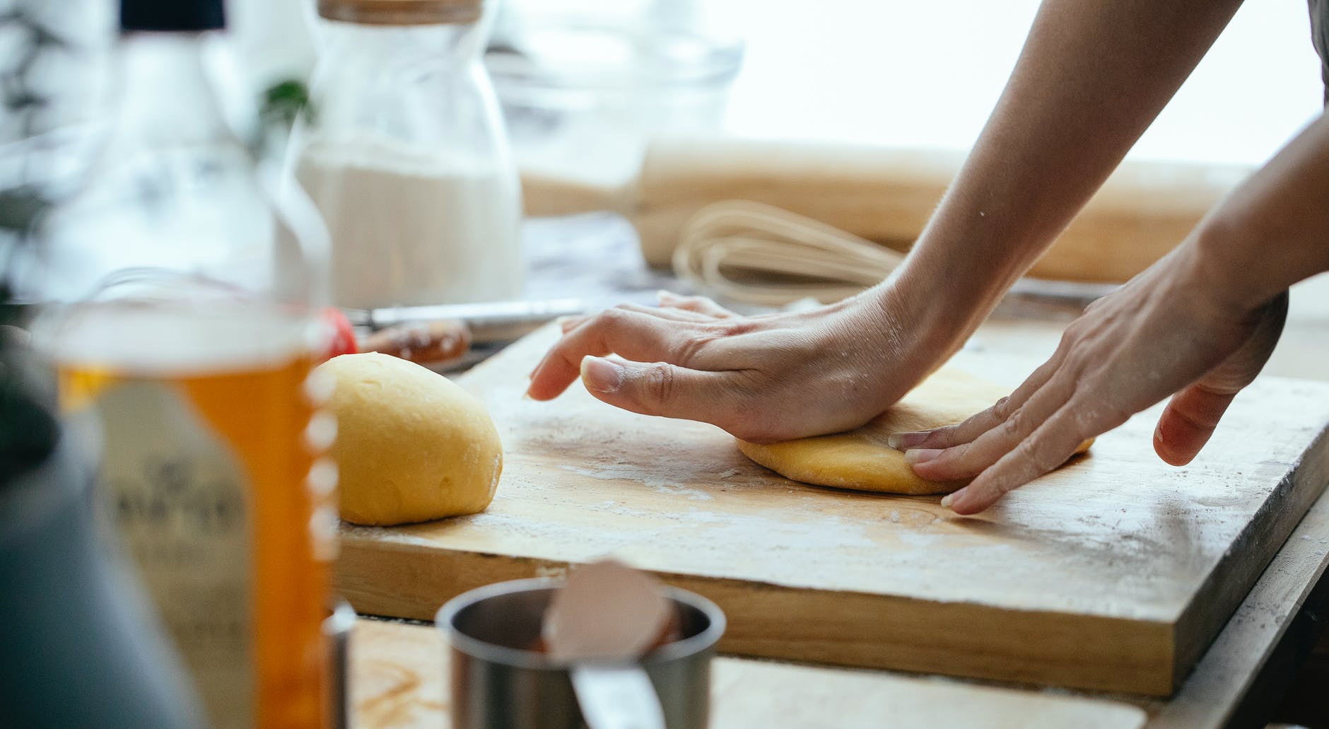 woman kneading dough in kitchen
